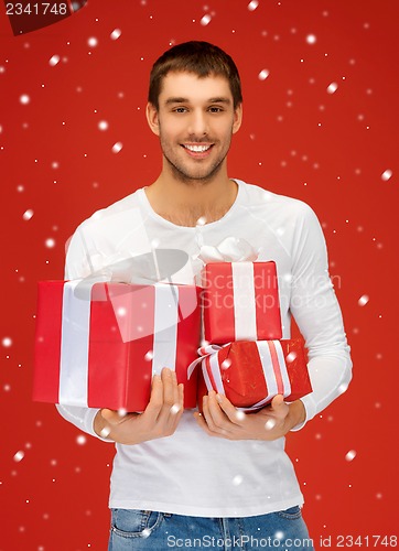 Image of man holding many gift boxes