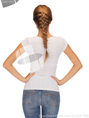 Image of rear view of woman in blank white t-shirt