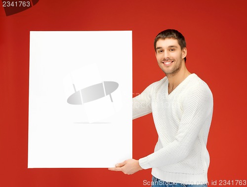Image of handsome man with big blank board