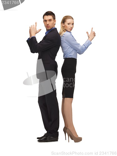 Image of man and woman making a gun gesture