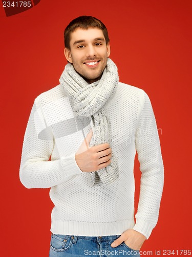 Image of handsome man in warm sweater and scarf