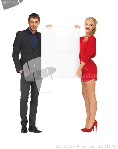 Image of couple holding big blank board