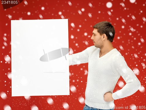 Image of handsome man with big blank board