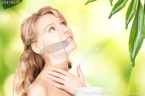 Image of beautiful woman with moisturizing creme