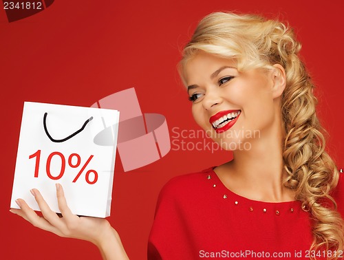 Image of lovely woman in red dress with shopping bag