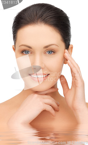 Image of face and hands of beautiful woman