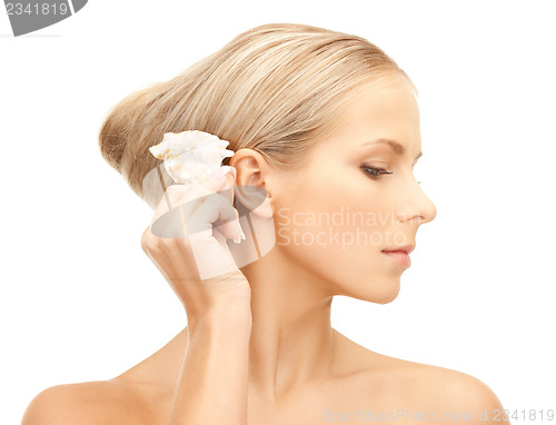Image of beautiful woman with seashell