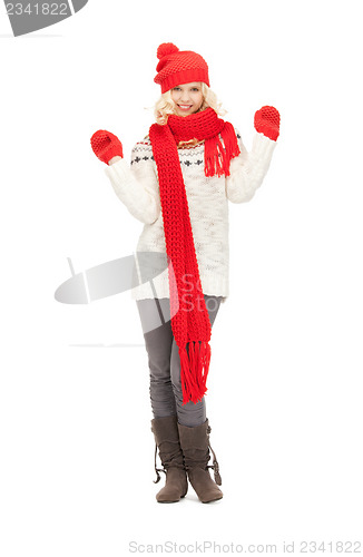 Image of beautiful woman in hat, muffler and mittens
