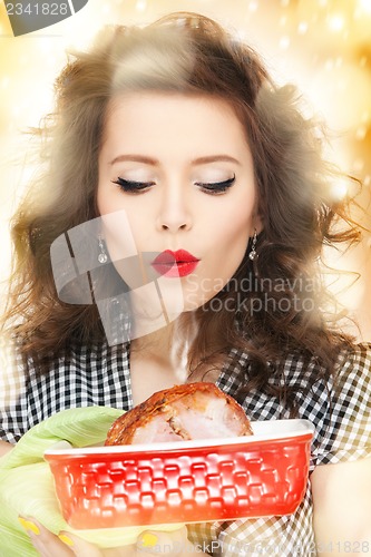 Image of lovely housewife with meat