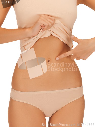 Image of woman body in beige cotton undrewear