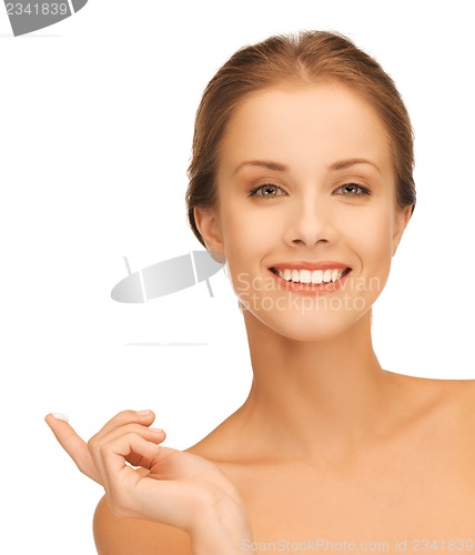 Image of beautiful woman with moisturizing creme drop