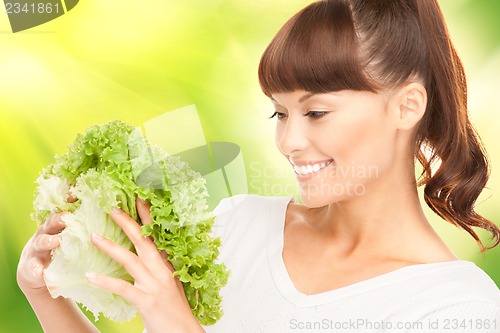 Image of beautiful housewife with lettuce