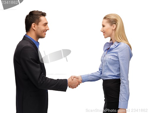 Image of man and woman shaking their hands