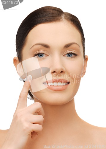 Image of beautiful woman with moisturizing creme drop