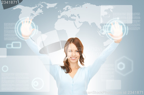 Image of businesswoman working with touch screen