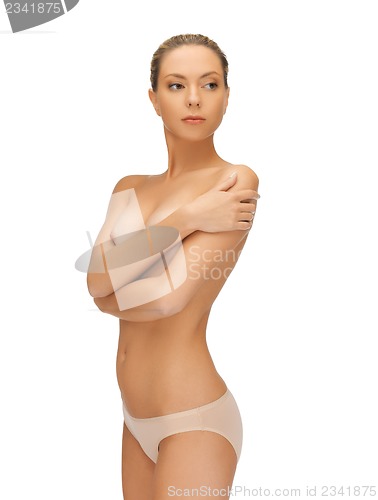 Image of beautiful topless woman in panties