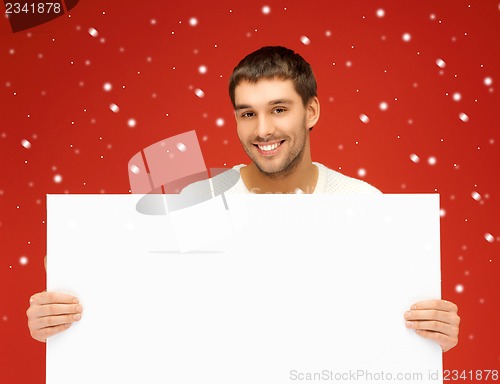 Image of handsome man with big blank board