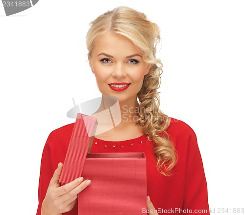 Image of lovely woman in red dress with opened gift box