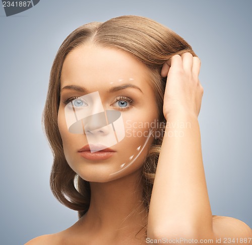 Image of face and hands of beautiful woman