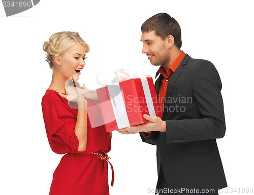 Image of man and woman with present