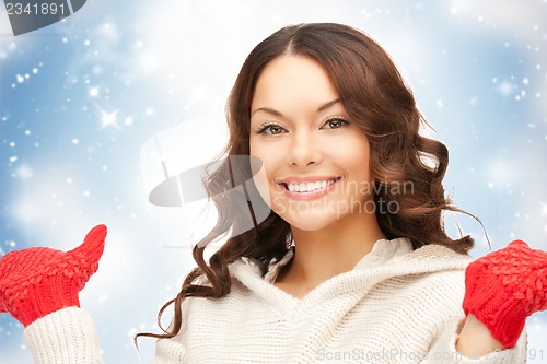 Image of beautiful woman in white sweater