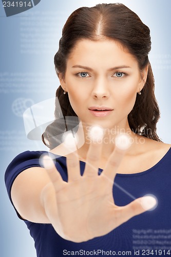 Image of businesswoman working with touch screen