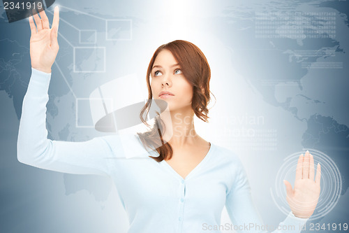 Image of businesswoman working with touch screen