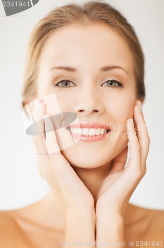 Image of face and hands of beautiful woman