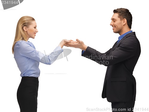 Image of man and woman showing something on the palms