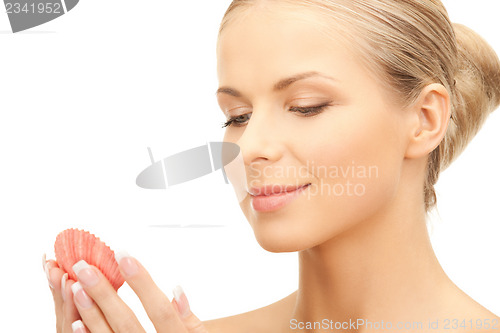 Image of beautiful woman with seashell