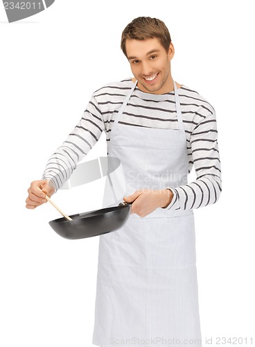 Image of handsome man with pan and spoon