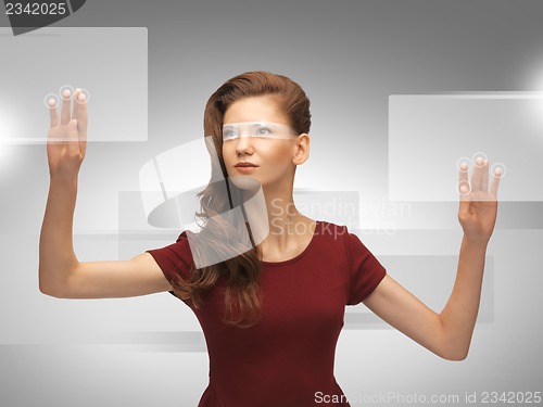 Image of teenage girl working with virtual screen