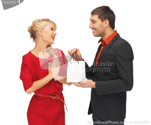 Image of man and woman with present