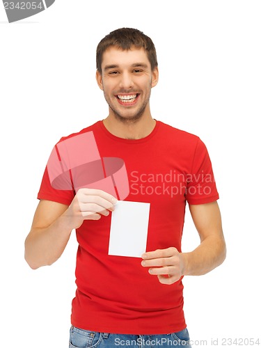 Image of handsome man with note card