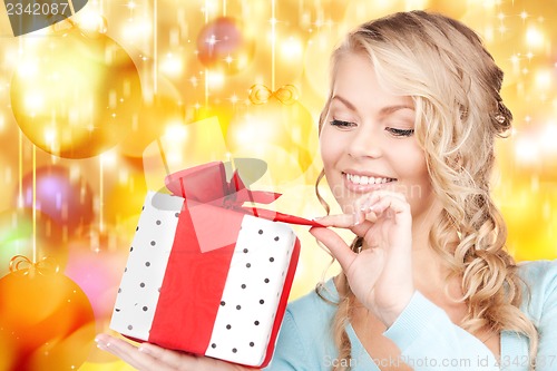Image of happy woman with gift box
