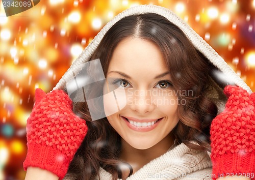 Image of beautiful woman in white sweater