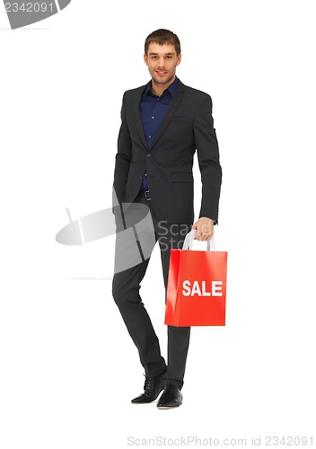 Image of handsome man in suit with shopping bags