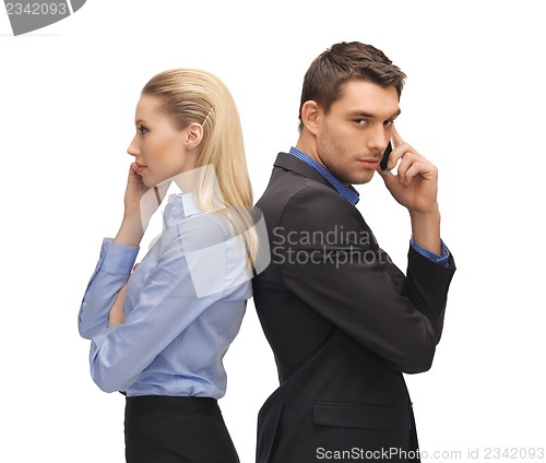 Image of man and woman with cell phones