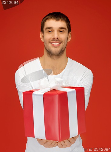 Image of handsome man with a gift