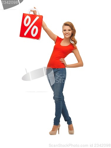 Image of teenage girl in red t-shirt with shopping bag