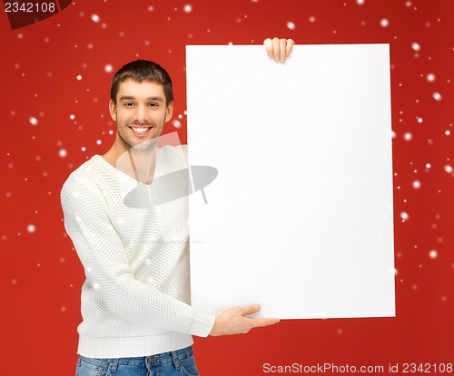 Image of handsome man with big blank board