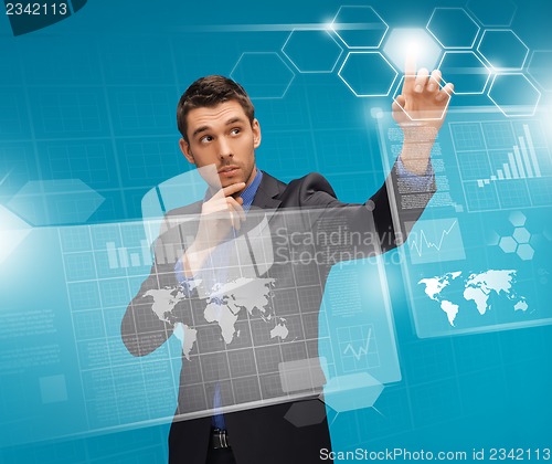 Image of man in suit working with virtual screens