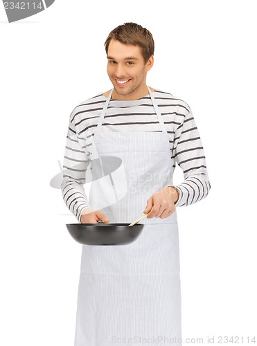 Image of handsome man with pan and spoon