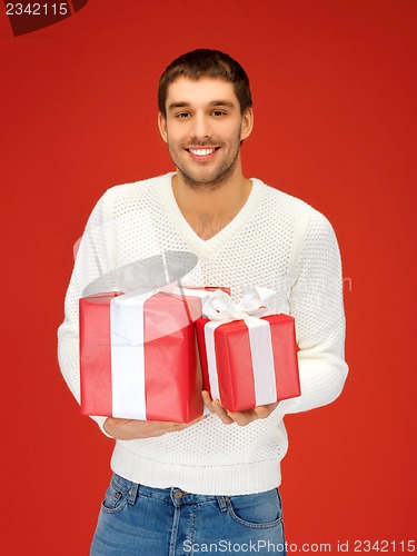 Image of man holding many gift boxes