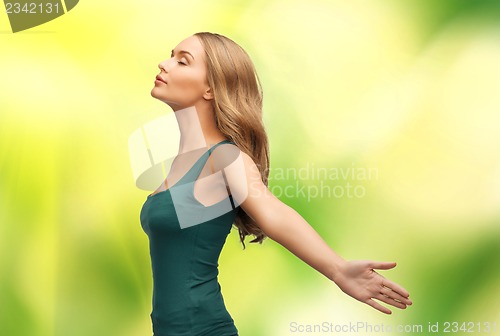 Image of woman spreading hands