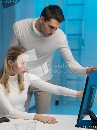 Image of man and woman in laboratory