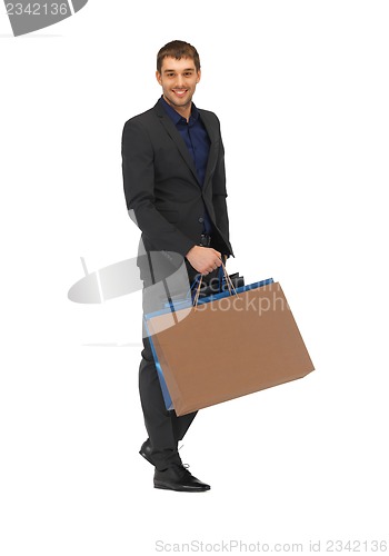 Image of handsome man in suit with shopping bags