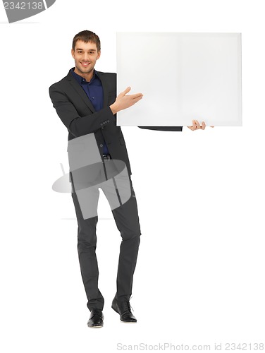 Image of handsome man in suit with a blank board