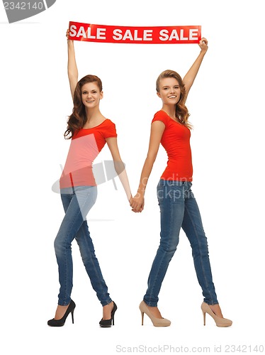 Image of two teenage girls with sale sign