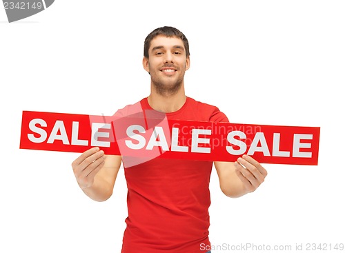 Image of handsome man with sale sign
